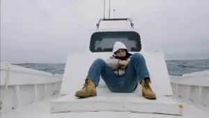 Seefeuer - Junge auf Boot